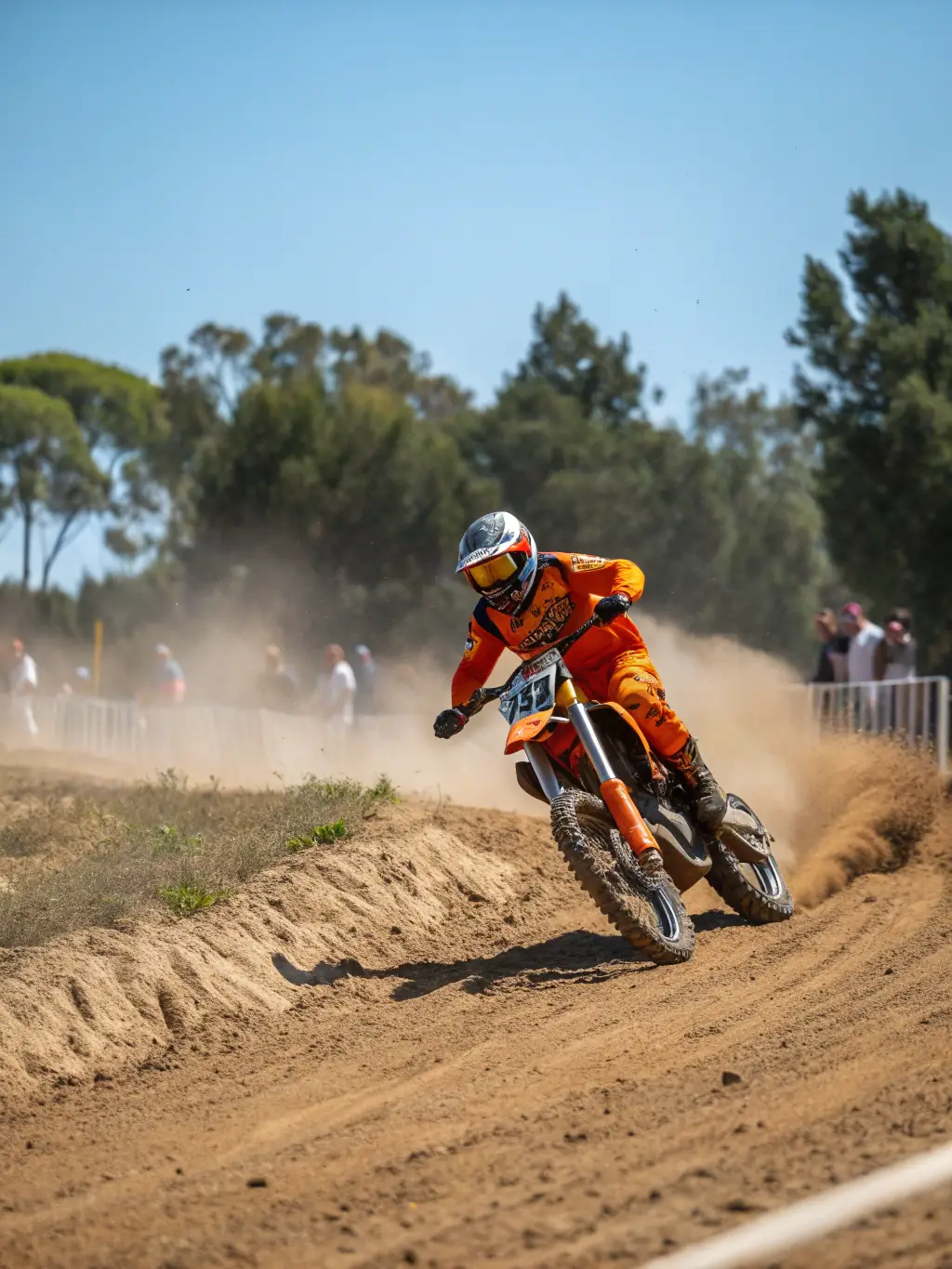 A high-action shot of motocross riders training on a dirt track, showcasing the intensity and skill involved in TEAM NBK's training sessions.